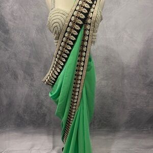 Vibrant Green Sari with Ornate Border